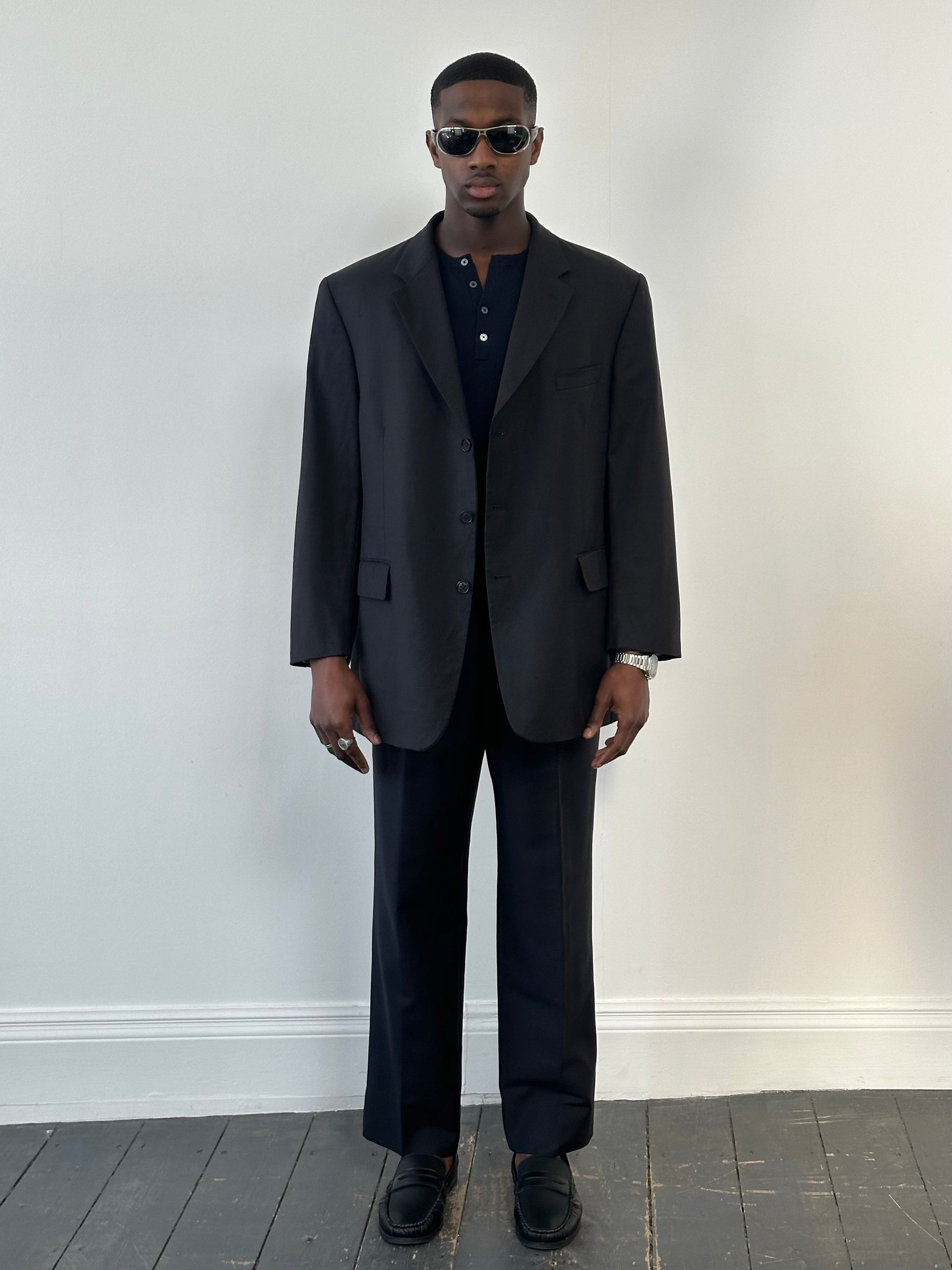 Yves Saint Laurent Pour Homme 1990s high neck wool blazer in size 48R, tailored fit with classic dark color, front view.