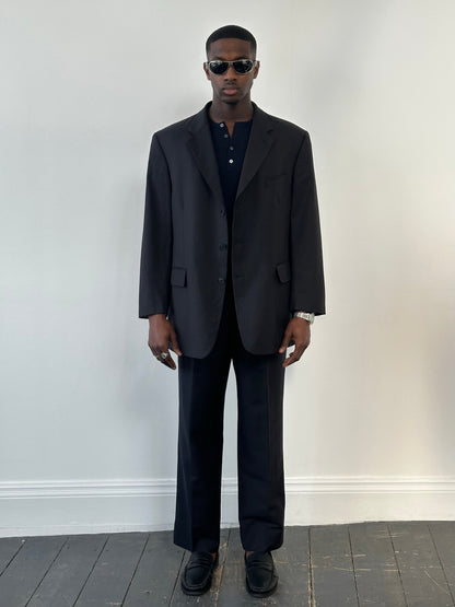 Yves Saint Laurent Pour Homme 1990s high neck wool blazer in size 48R, tailored fit with classic dark color, front view.