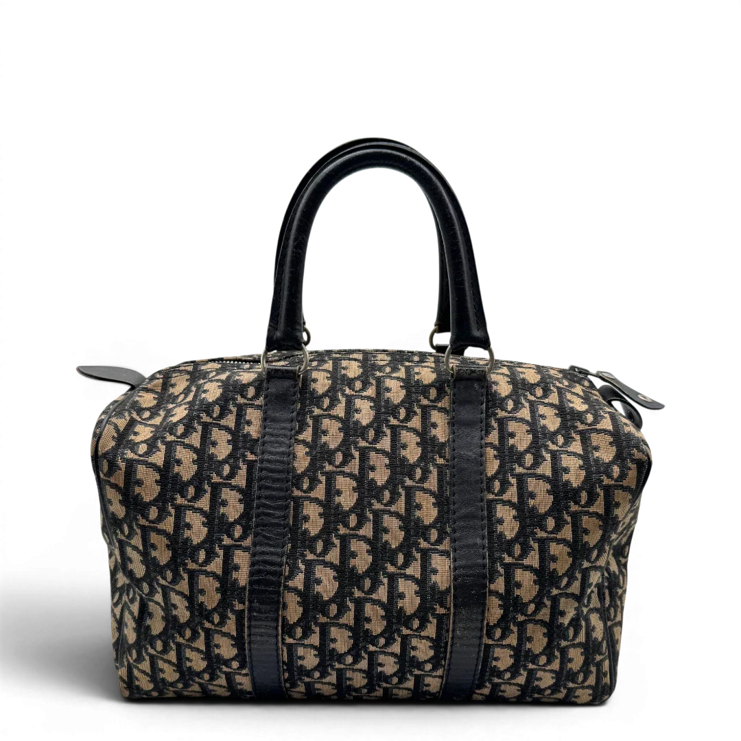 https://cdn.shopify.com/s/files/1/0564/9376/8855/files/dior_boston_30_vintage_monogram_beige_christian_dior_oblique_boston_bag_vintage_dior_handtasche_canvas_beige1767.webp?v=1779406963