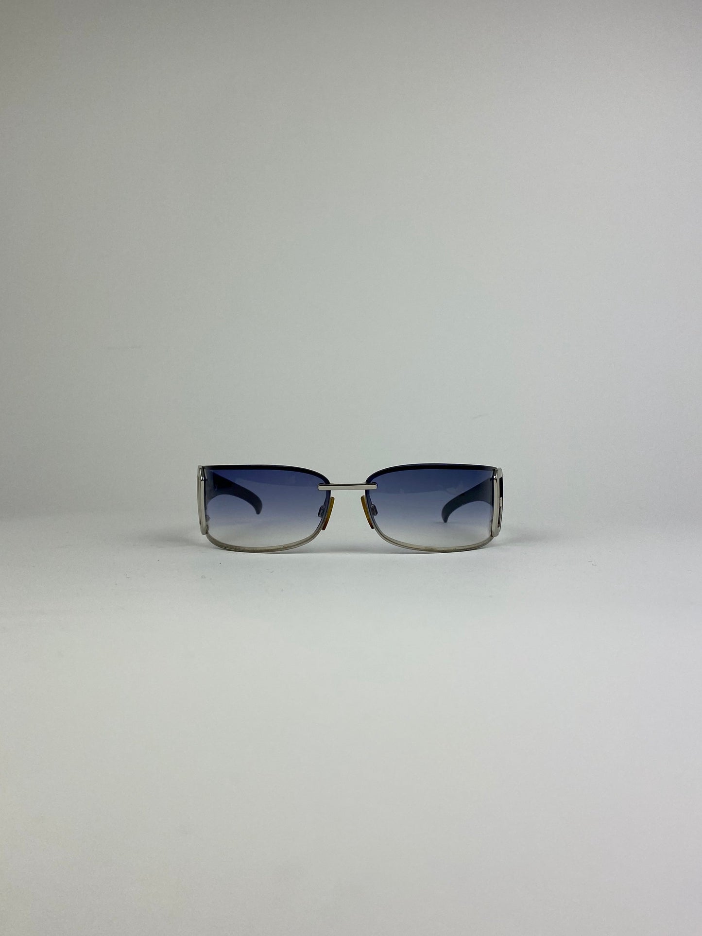 Dolce & Gabbana shield sunglasses with blue tinted lenses and sleek black frame, stylish and protective eyewear.