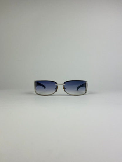 Dolce & Gabbana shield sunglasses with blue tinted lenses and sleek black frame, stylish and protective eyewear.