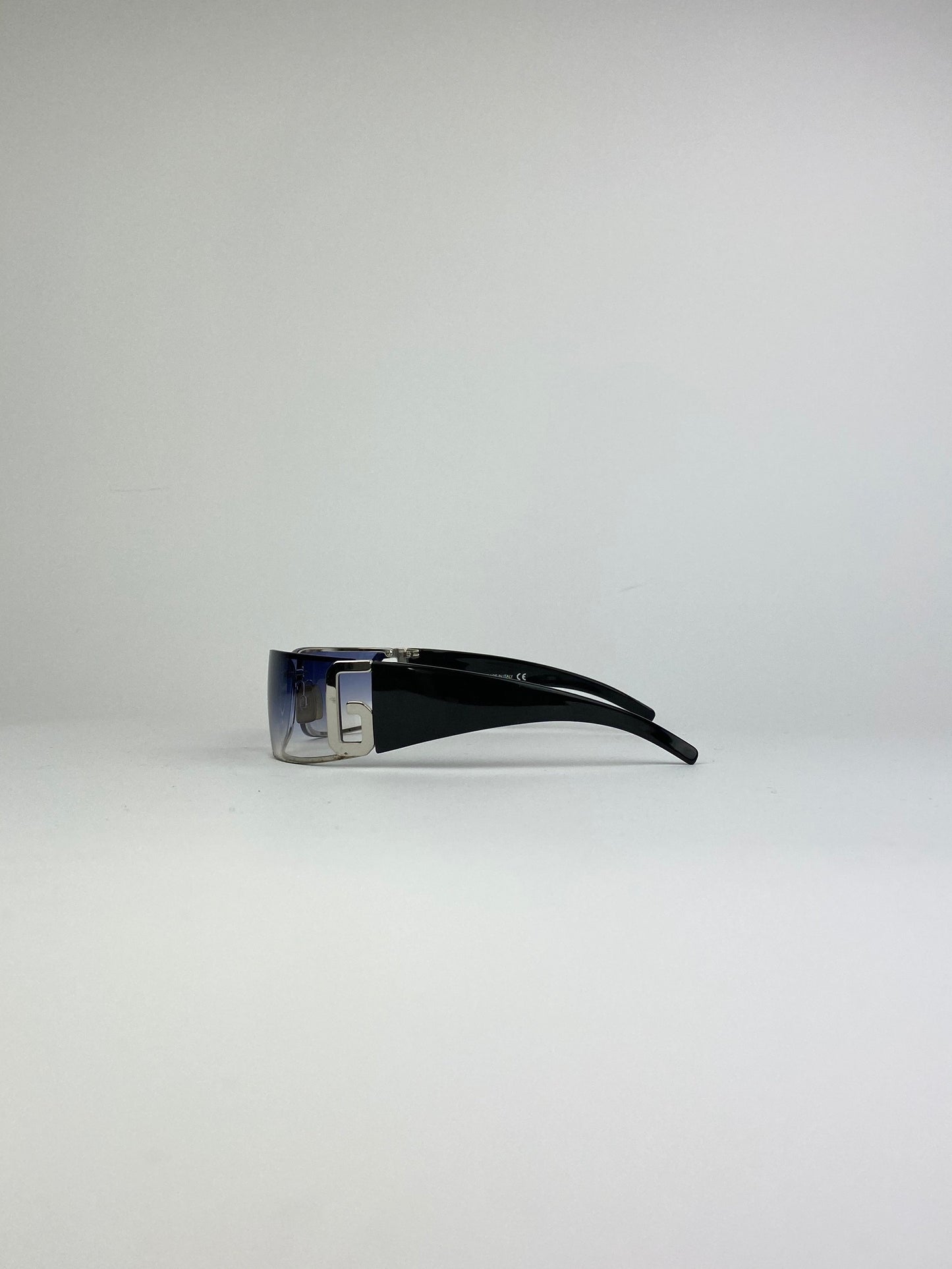 Blue Dolce & Gabbana Shield sunglasses with oversized frame and dark tinted lenses, stylish and fashionable eyewear.
