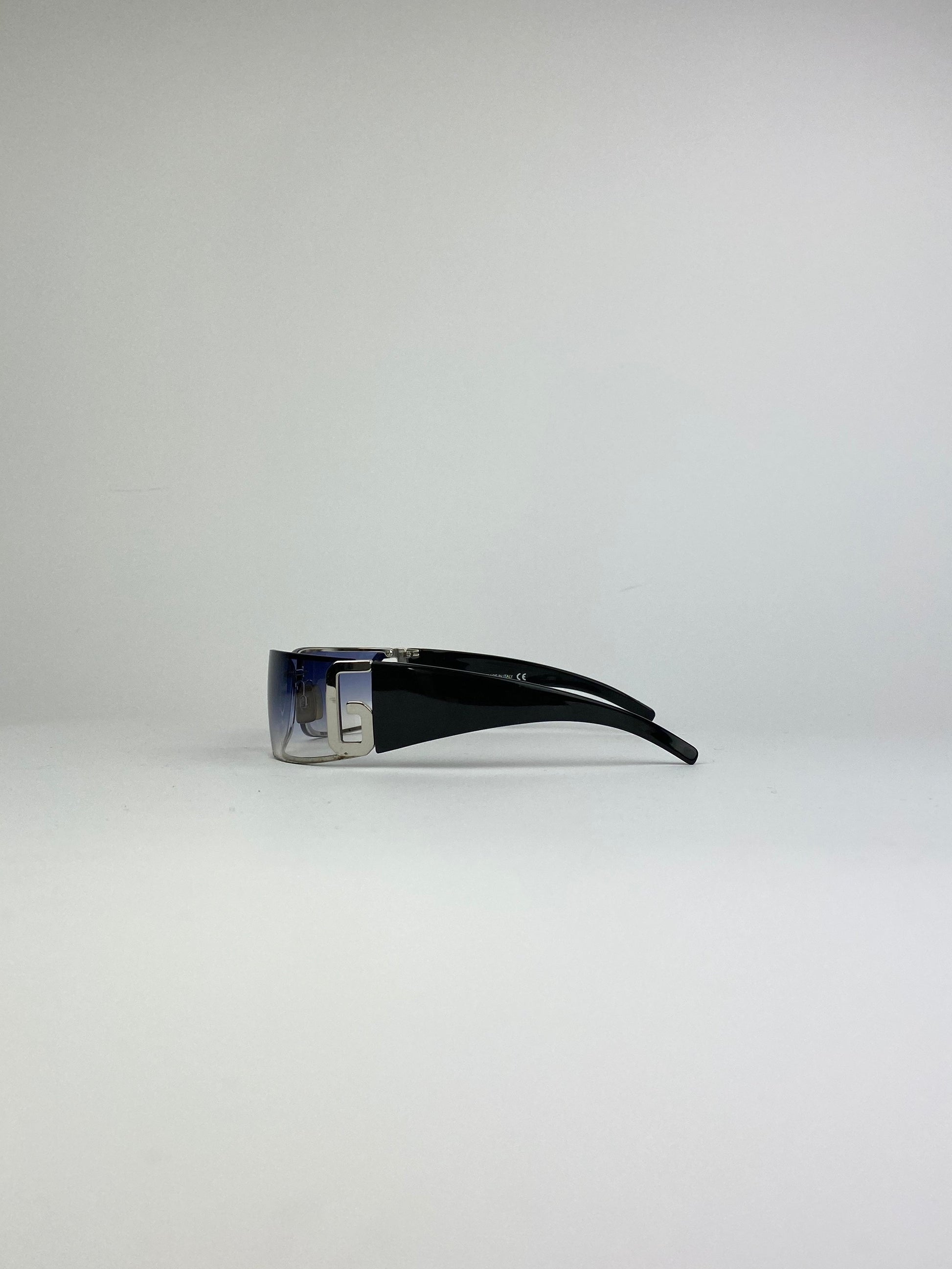 Blue Dolce & Gabbana Shield sunglasses with oversized frame and dark tinted lenses, stylish and fashionable eyewear.