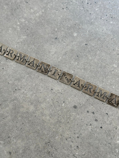 Armani Jeans 1990s monogram chain belt, one size, featuring gold-tone chain and monogram details, on a neutral background.