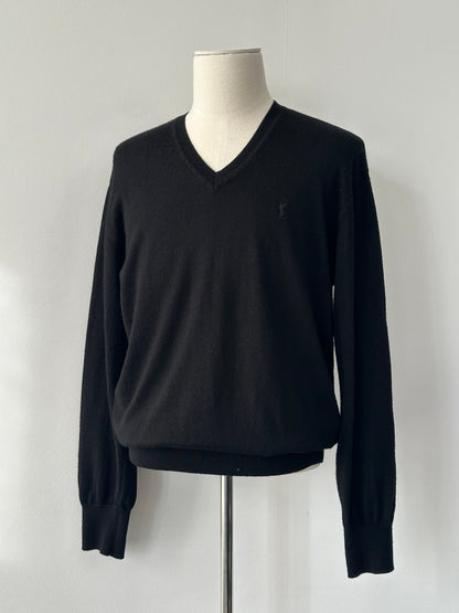 Yves Saint Laurent 1990s pure wool V-neck jumper in size M, beige color, close-up of knit fabric and classic design.