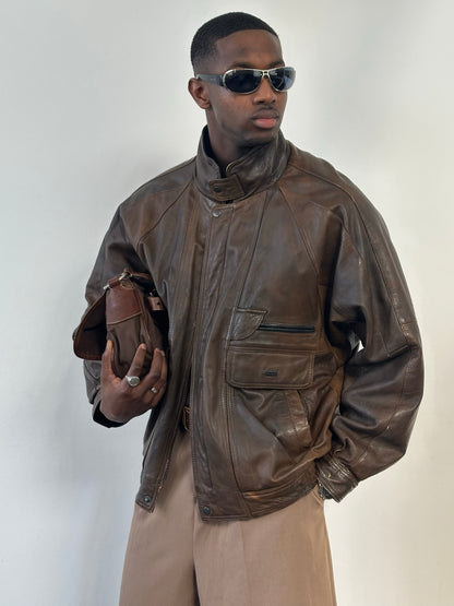 Vintage 1990s high neck leather bomber jacket in XL, featuring classic leather texture and vintage style details.