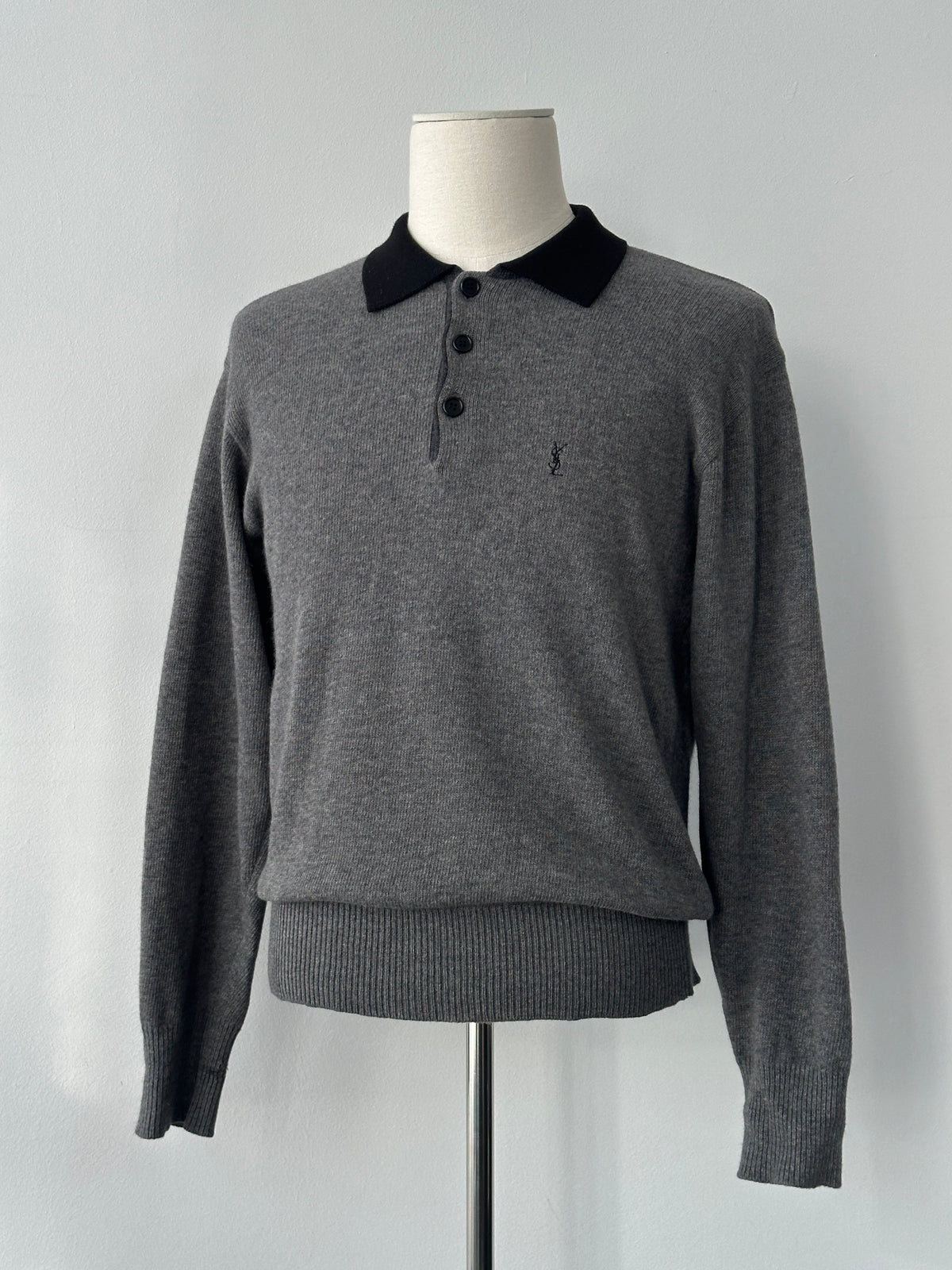 Yves Saint Laurent 1990s wool polo jumper in navy, size S-M, featuring a classic collar and ribbed cuffs and hem.