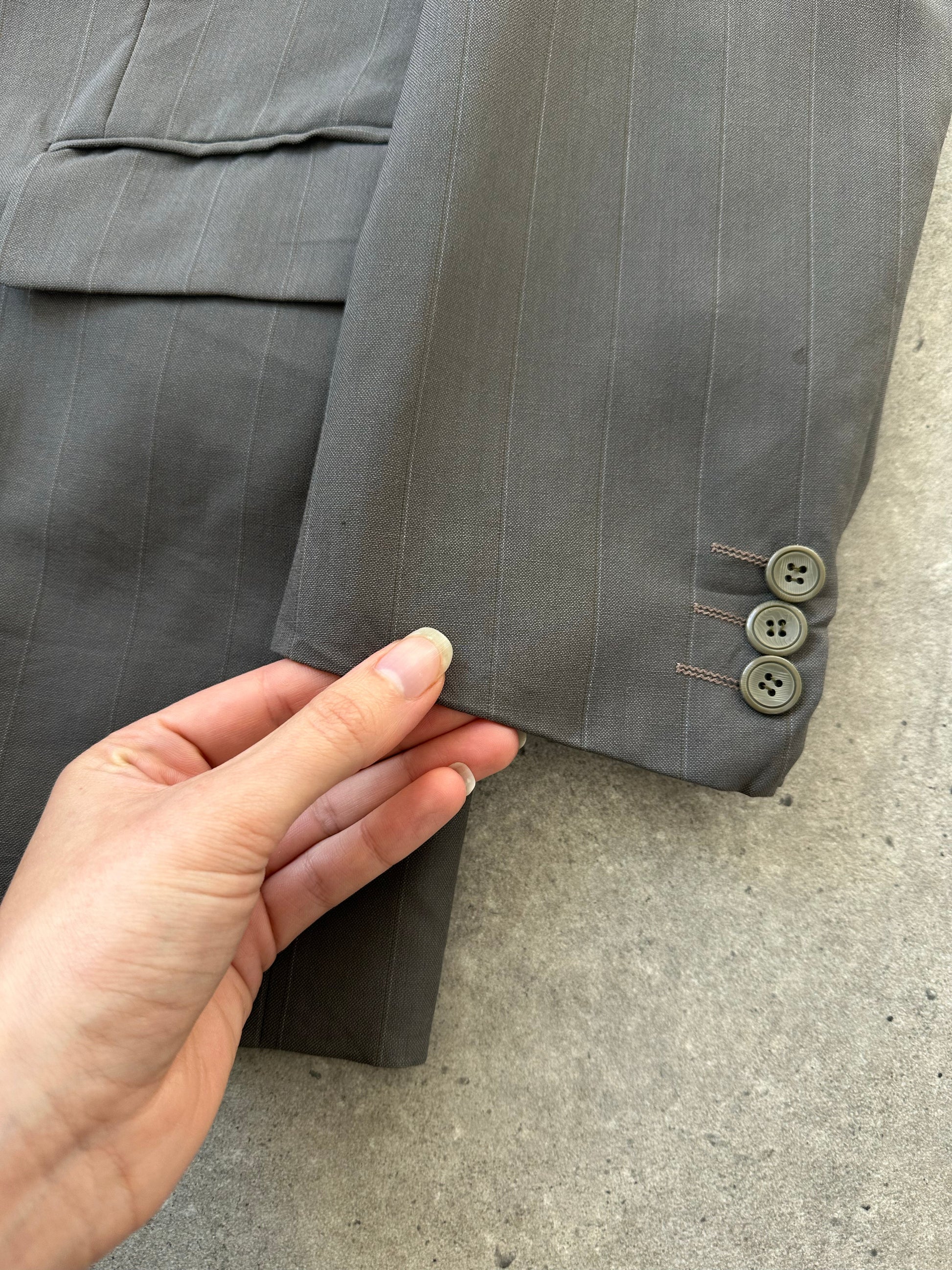 Yves Saint Laurent 1990s double-breasted wool blazer in navy, featuring classic lapels and structured fit.