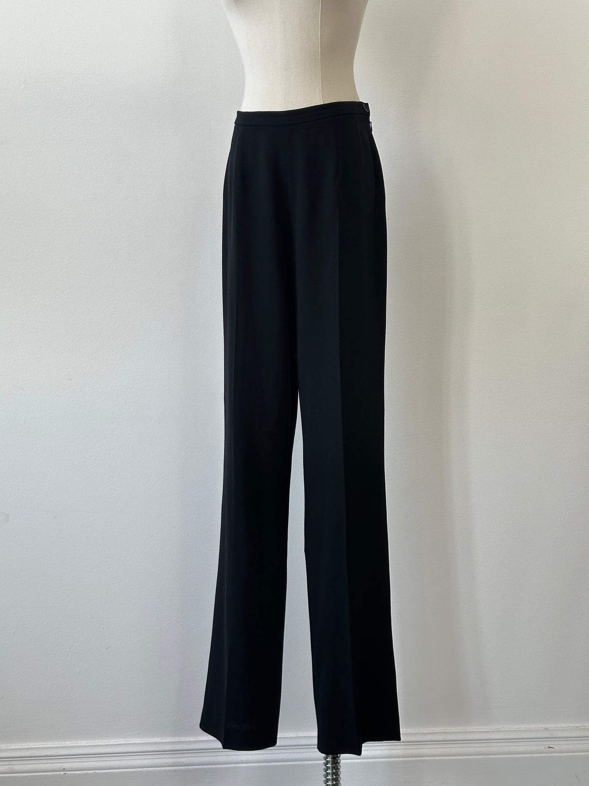 Max Mara 1990s pure wool straight-leg trousers in W28, shown hanging with a tailored fit and classic style.
