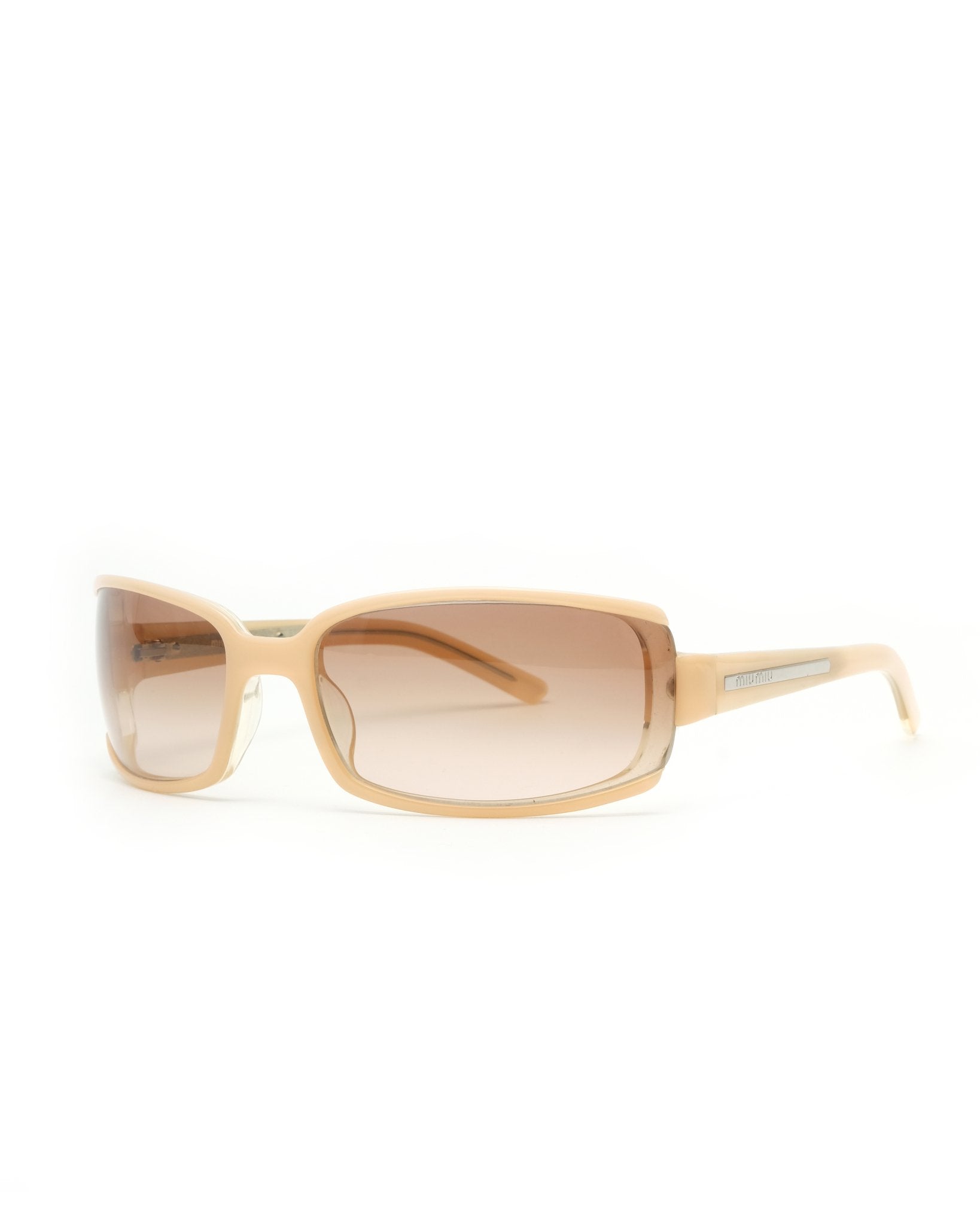 https://cdn.shopify.com/s/files/1/0818/5459/5398/files/early-2000s-miu-miu-sunglasses-141578.jpg?v=1749595207
