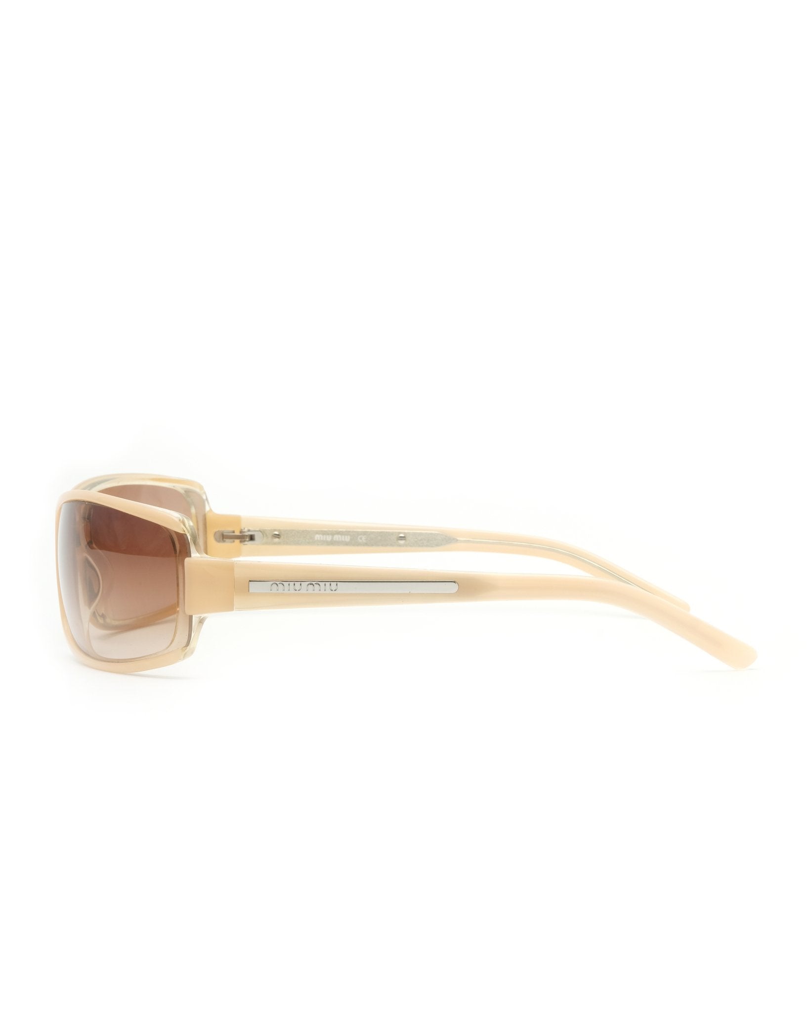 https://cdn.shopify.com/s/files/1/0818/5459/5398/files/early-2000s-miu-miu-sunglasses-232758.jpg?v=1749595207