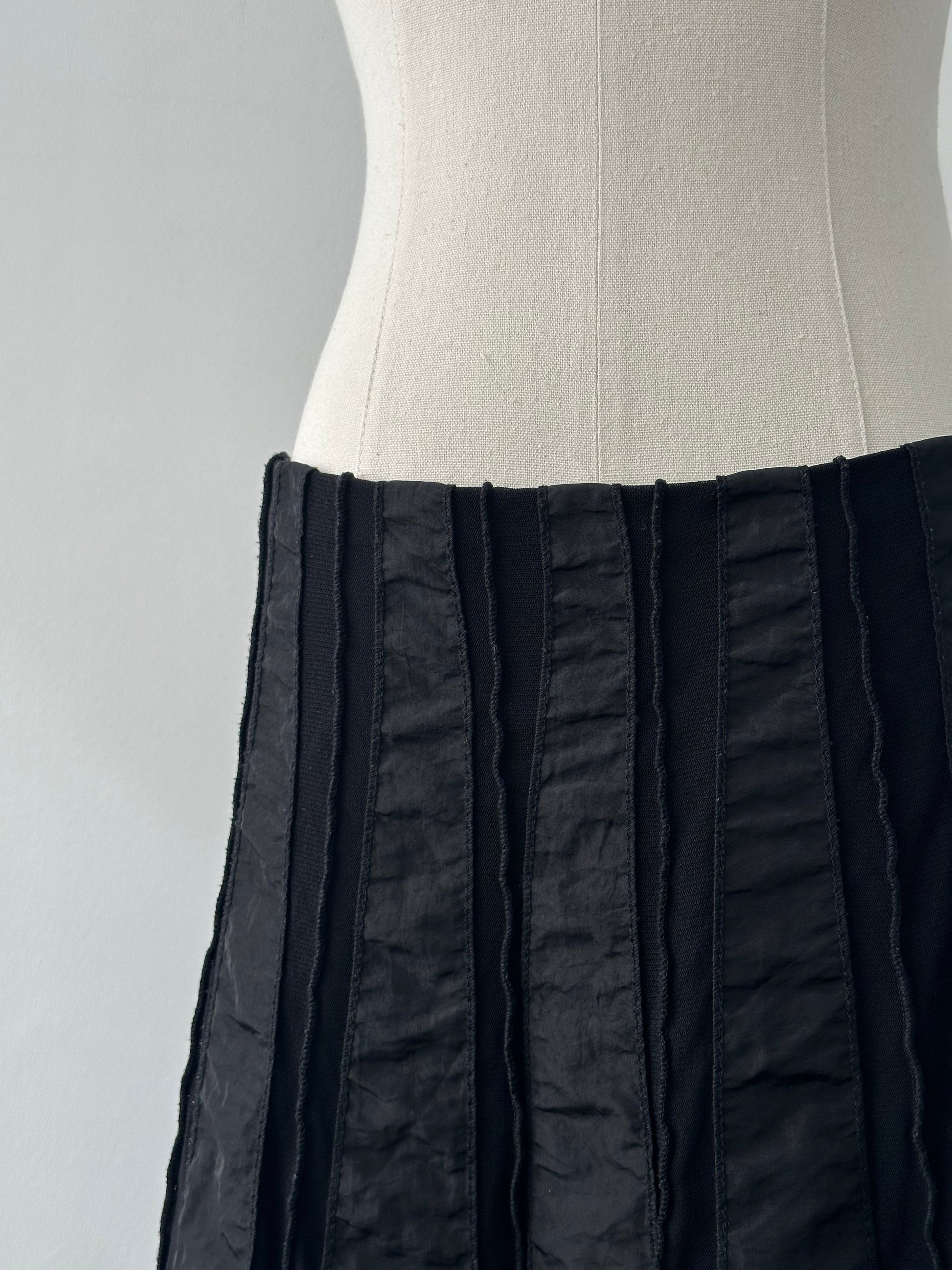 Vintage Italian 1990s satin paneled midi skirt in W28-32, showcasing elegant vintage fashion with a classic mid-length design.