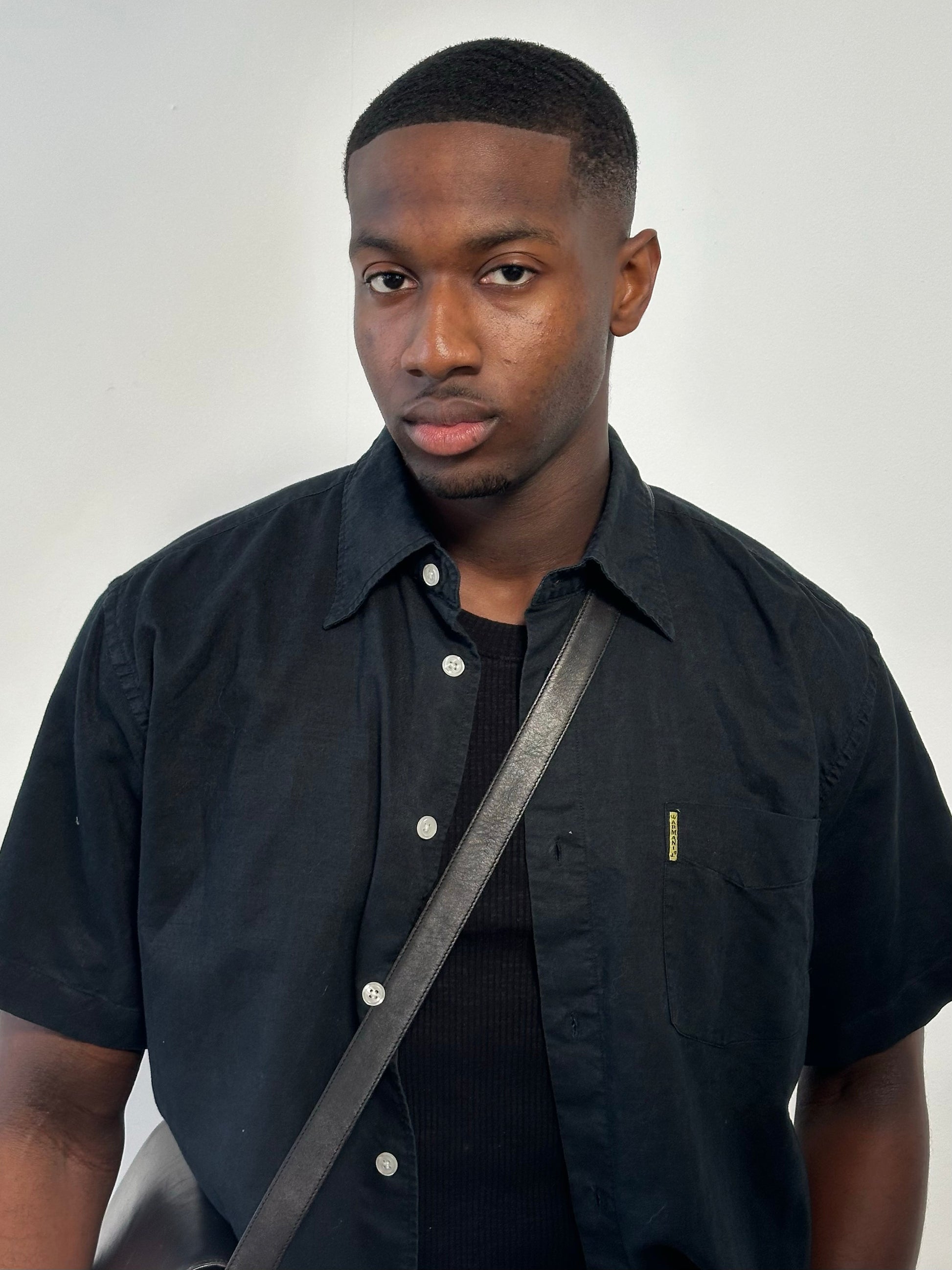 Armani Jeans 1990s pure cotton short sleeve shirt in size M, featuring classic design and soft fabric, displayed on a hanger.