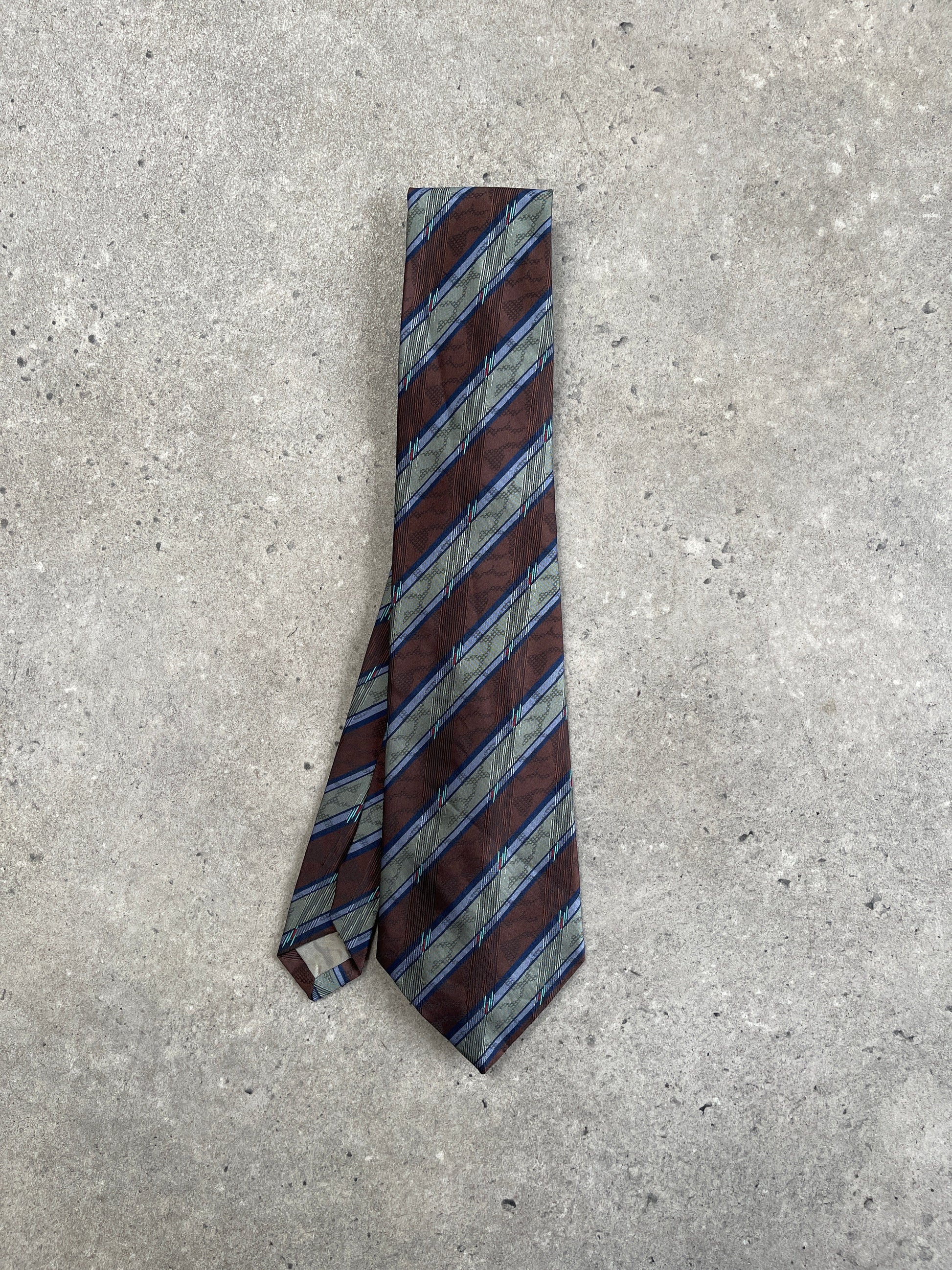 Vintage 1980s diagonal striped tie showcasing bold pattern and classic style, made by Vintage brand.