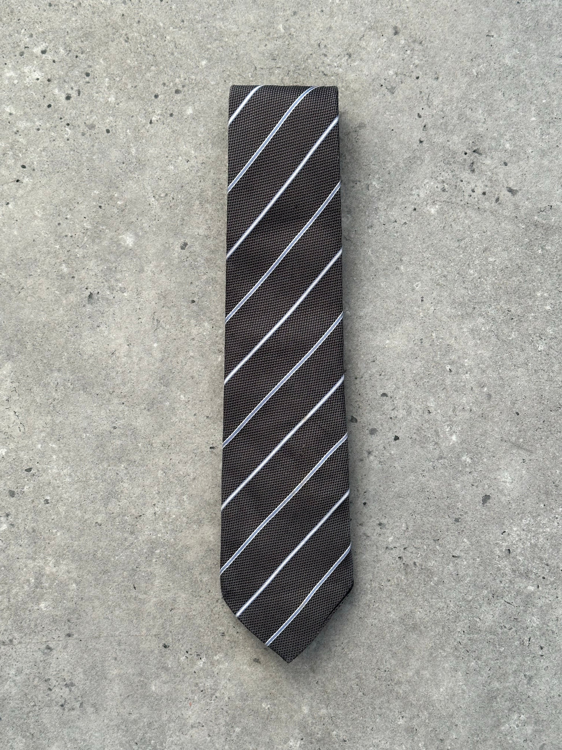 Burberry Black Label 2000s pure silk striped tie with classic design, featuring bold black and white pattern, stylish accessory for formal wear.