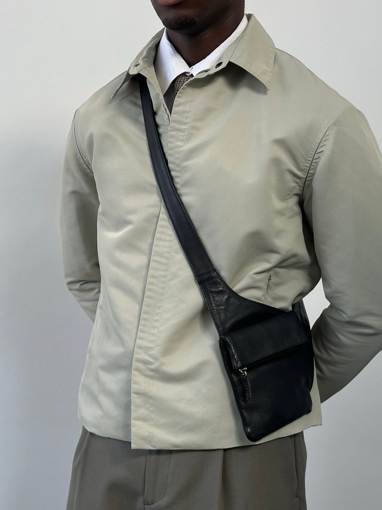 Gianfranco Ferre 1990s showerproof minimal jacket in size L, lightweight outdoor jacket with sleek design and waterproof fabric.