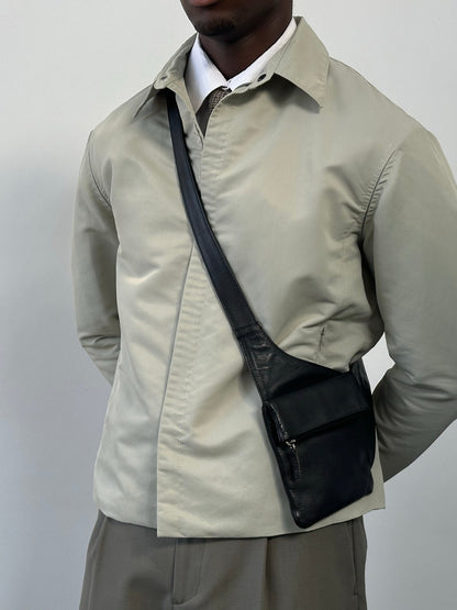 Gianfranco Ferre 1990s showerproof minimal jacket in size L, lightweight outdoor jacket with sleek design and waterproof fabric.