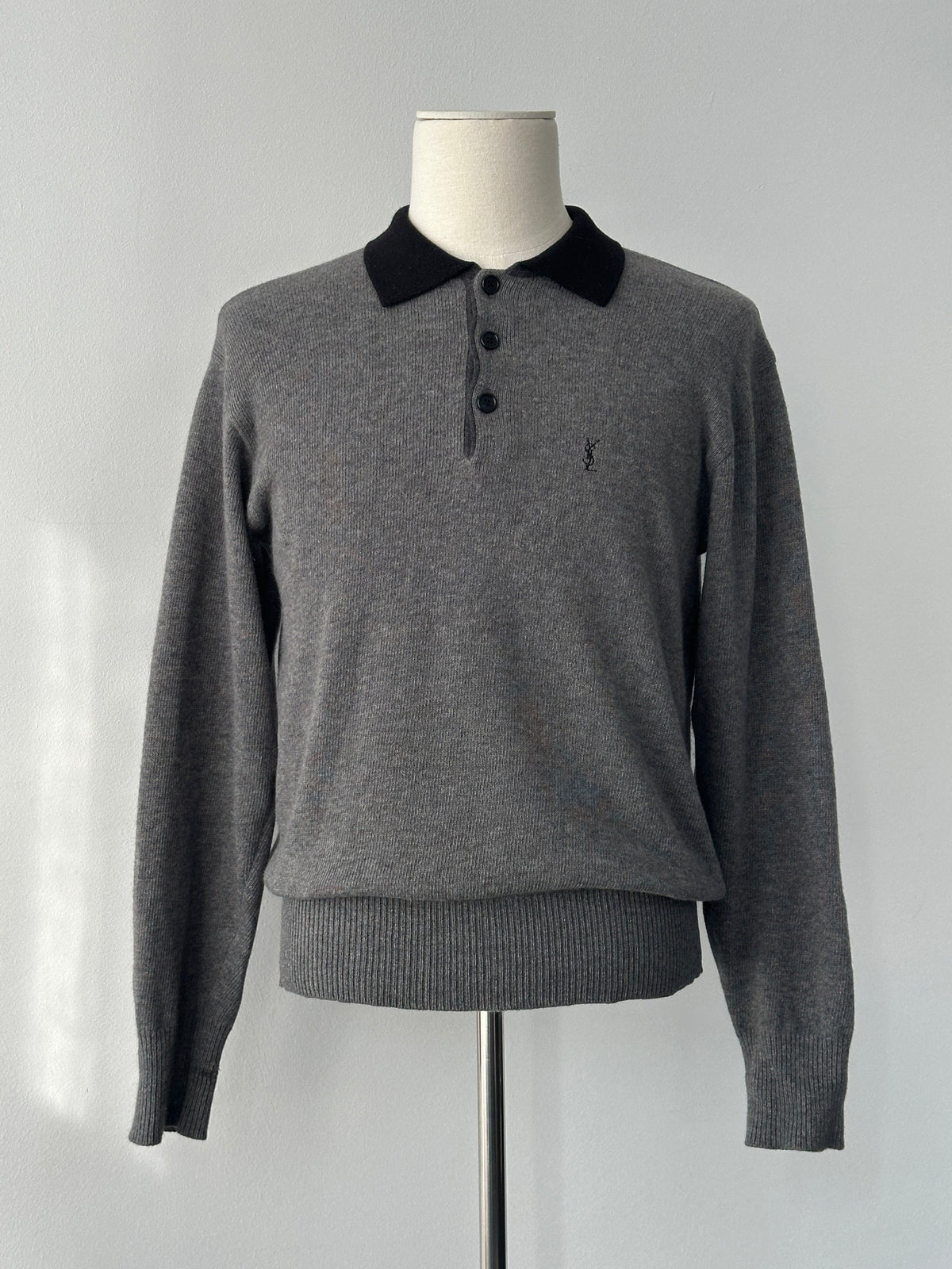 Yves Saint Laurent 1990s wool polo jumper in black, size S-M, featuring a classic collar and ribbed cuffs.