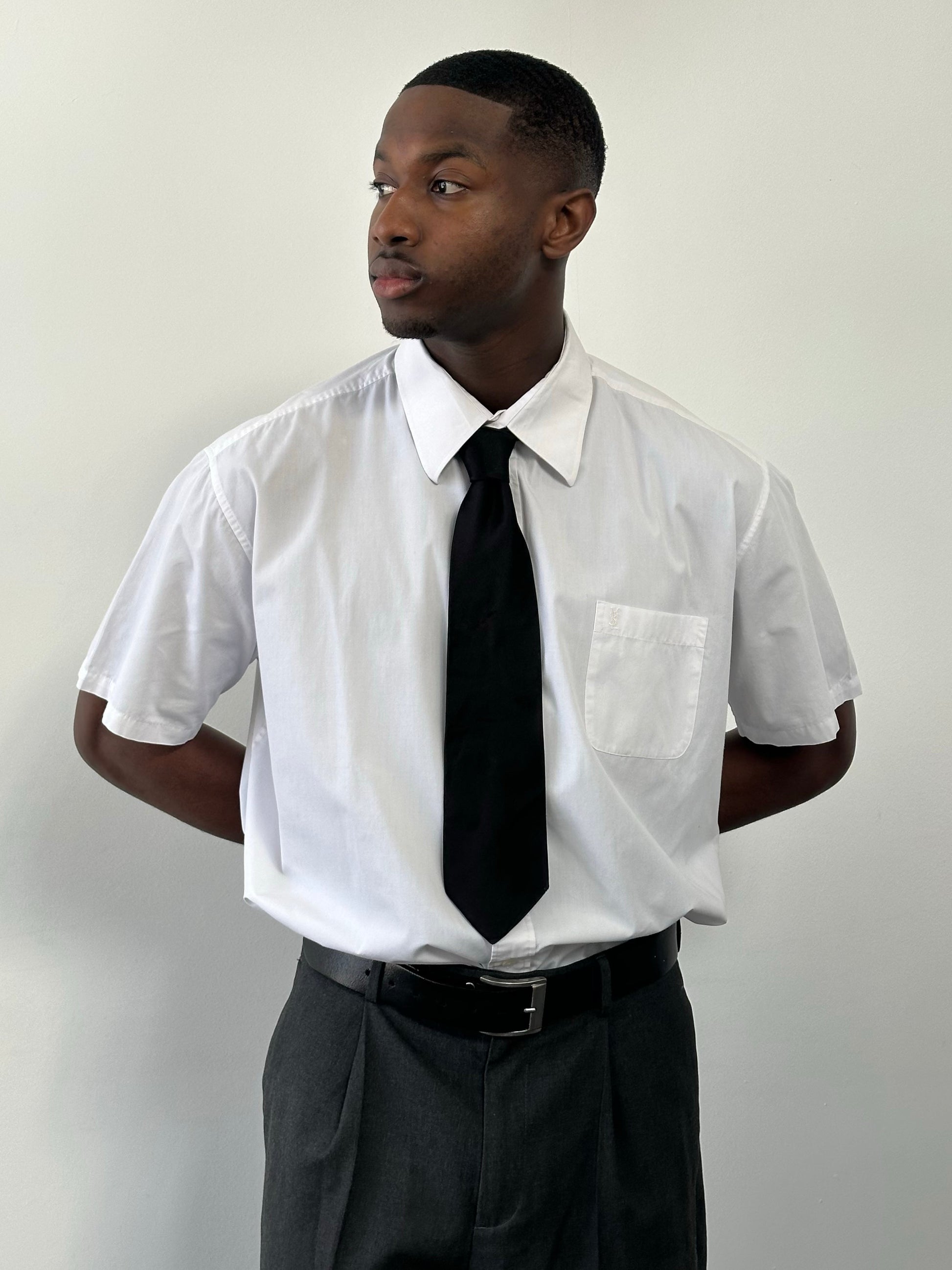 Yves Saint Laurent Pour Homme 1990s cotton short sleeve logo shirt, XXL size, white with black brand logo, laid flat.