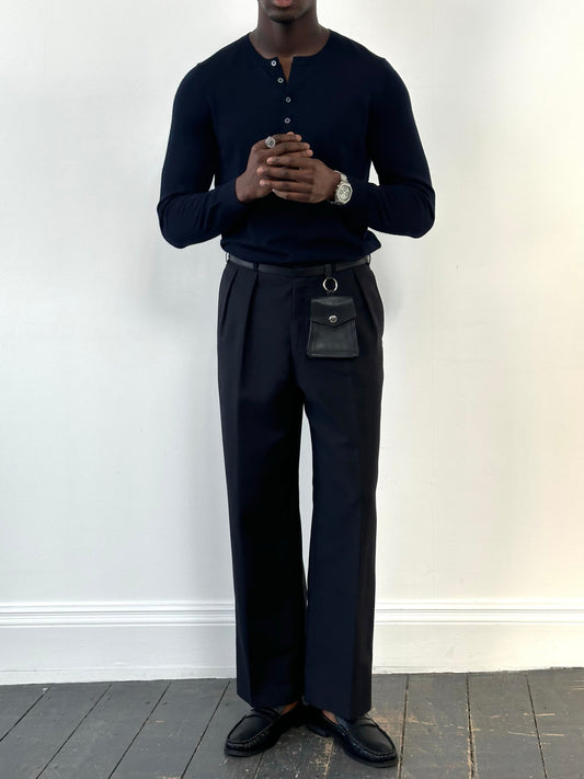 Vintage 1990s wool mohair pleated trousers in size W34, showcasing classic tailored style and textured fabric.