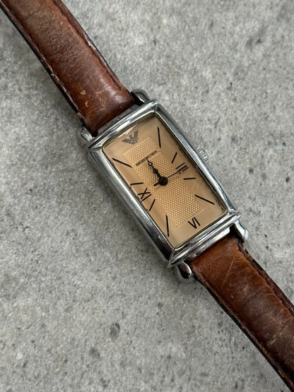 Emporio Armani 2000s leather watch with a sleek round dial and classic leather strap, showcasing elegant timepiece design.