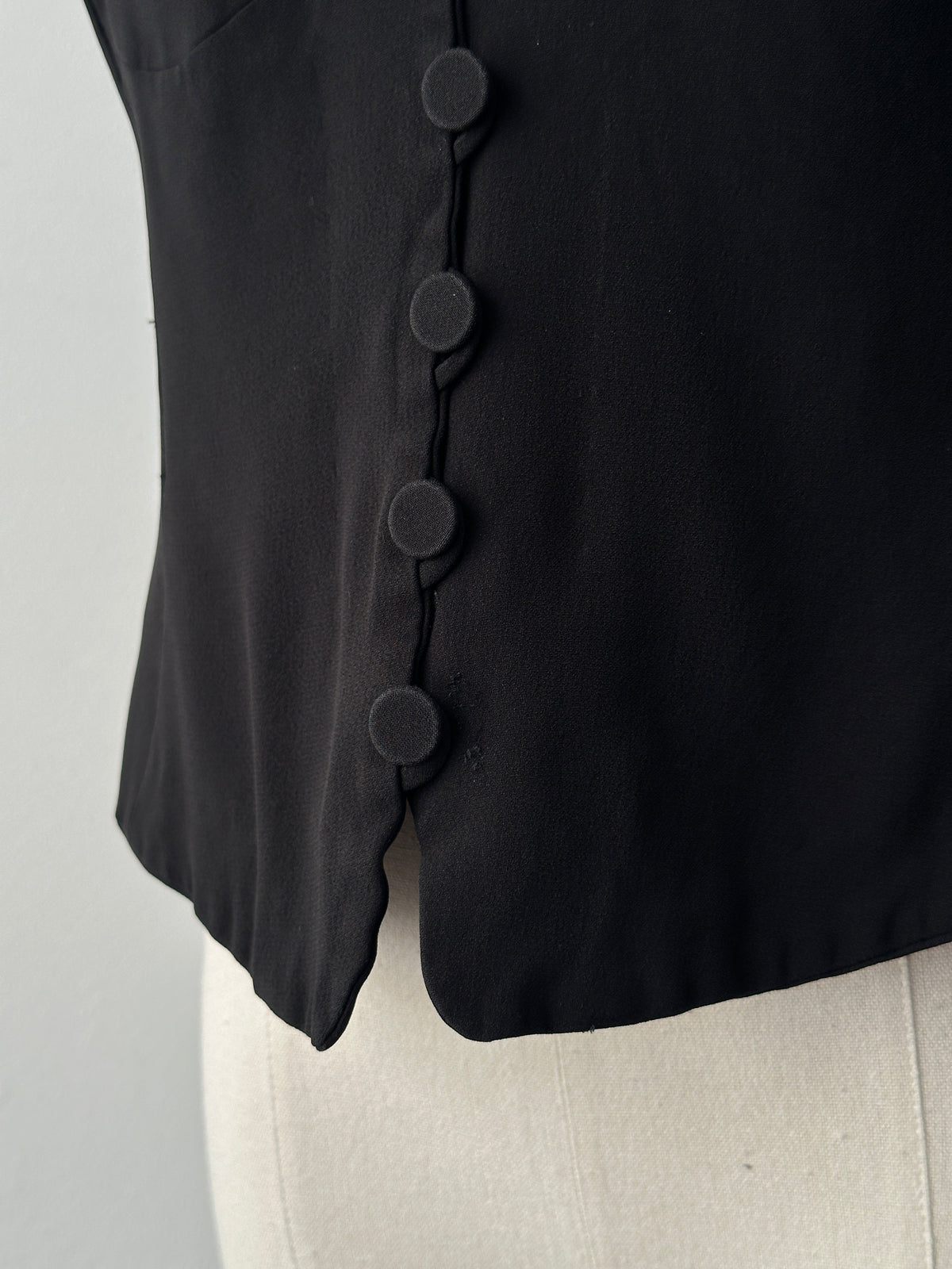 Emporio Armani 1990s fitted tailored single-button waistcoat in dark fabric, front view showing classic design and sleek fit.