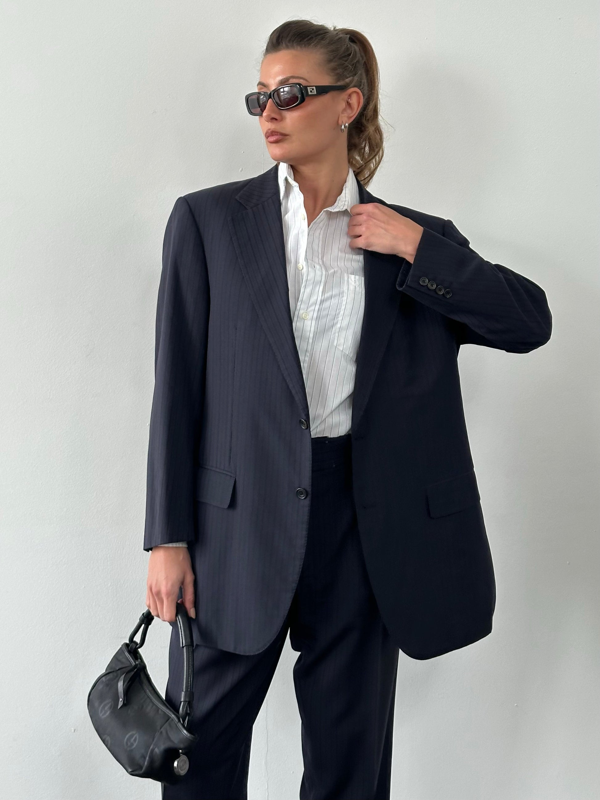 Burberry London 1990s pure wool striped suit jacket and trousers in size 42S/W34, classic tailored style with bold striped pattern.