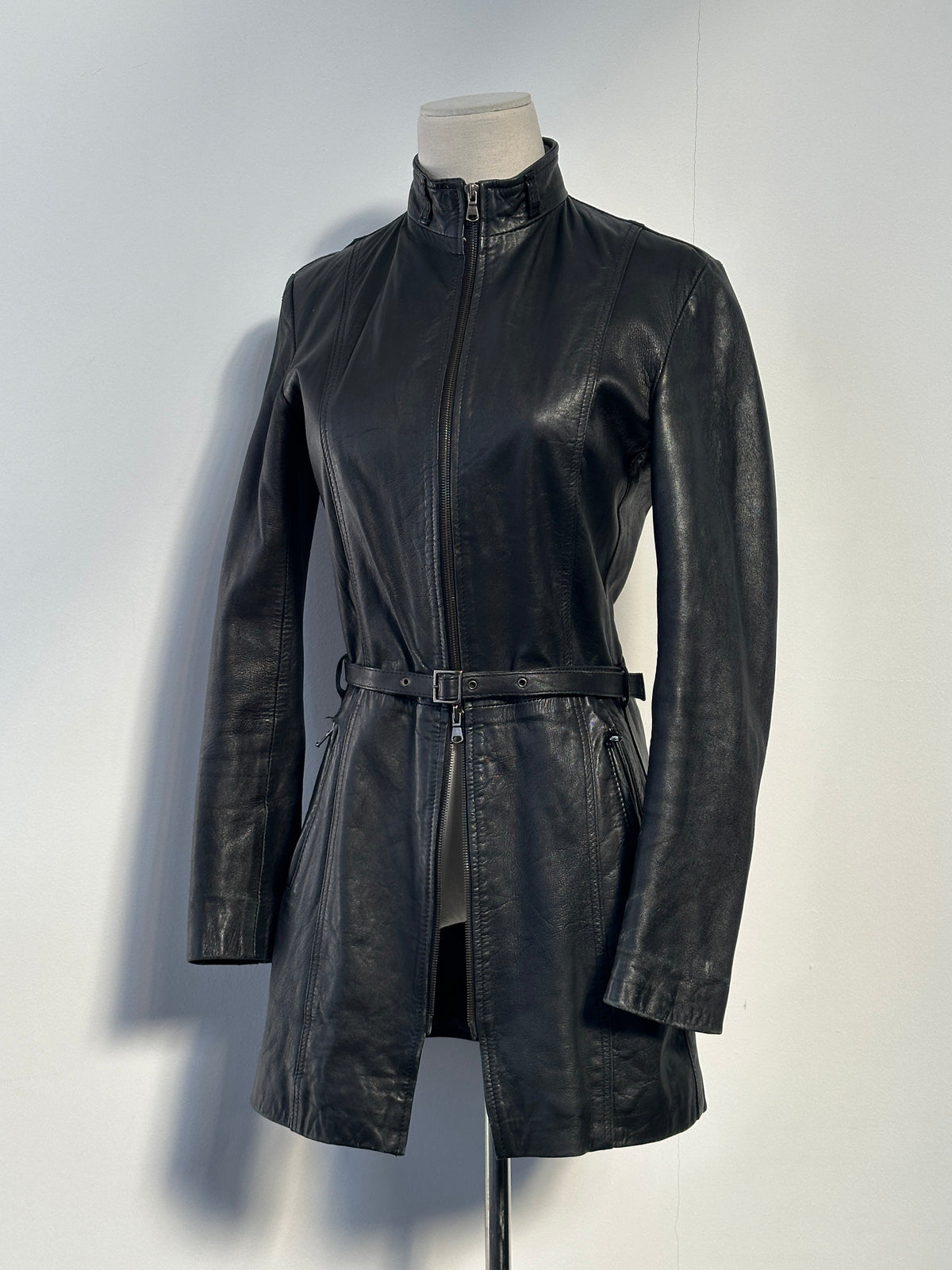 Italian vintage 1990s double zip belted leather jacket in XS, featuring classic leather texture and retro design.
