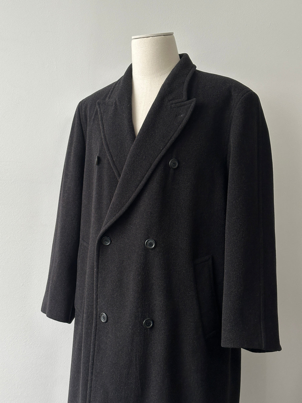 Vintage 1990s pure wool double-breasted coat in XL, showcasing classic design, tailored fit, and textured wool fabric.