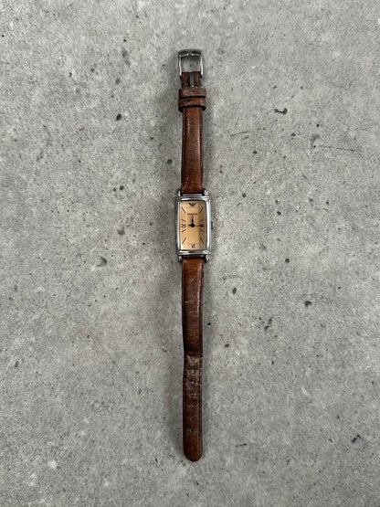 Emporio Armani 2000s leather watch with round dial, silver-tone case, and black leather strap, showcasing classic elegant design.