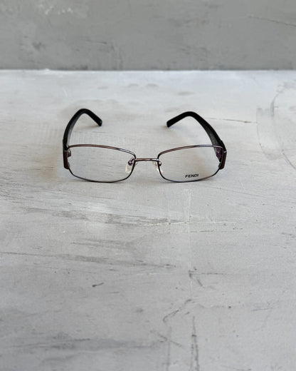 Fendi Clear Lens Silver Frame Glasses-on a concrete background
