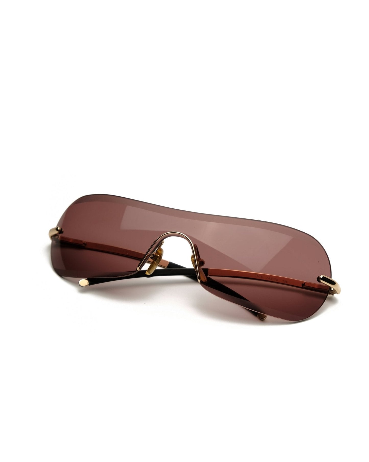 https://cdn.shopify.com/s/files/1/0818/5459/5398/files/giorgio-armani-giorgio-armani-spring-2001-shield-vintage-su468-3307878.jpg?v=1778953753