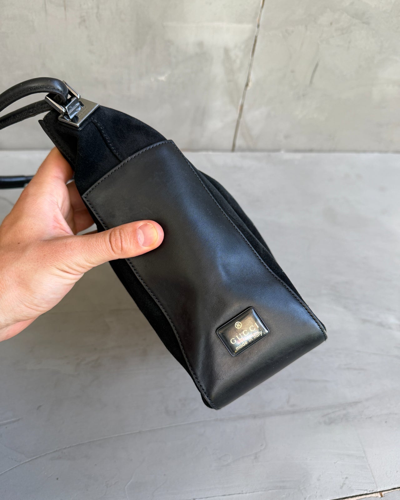 Gucci by Tom Ford Black Leather and Suede Shoulder Bag-on a concrete background