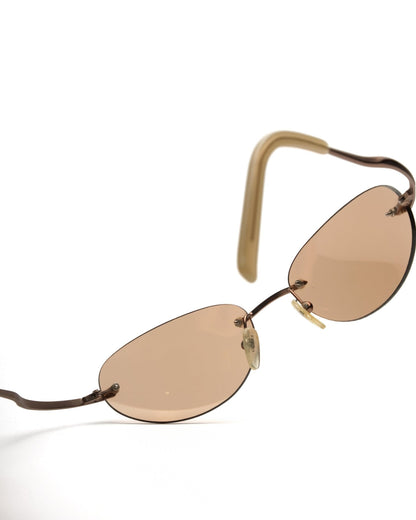 https://cdn.shopify.com/s/files/1/0818/5459/5398/files/guess-guess-rimless-sunglasses-vintage-su357-1929633.jpg?v=1766681208