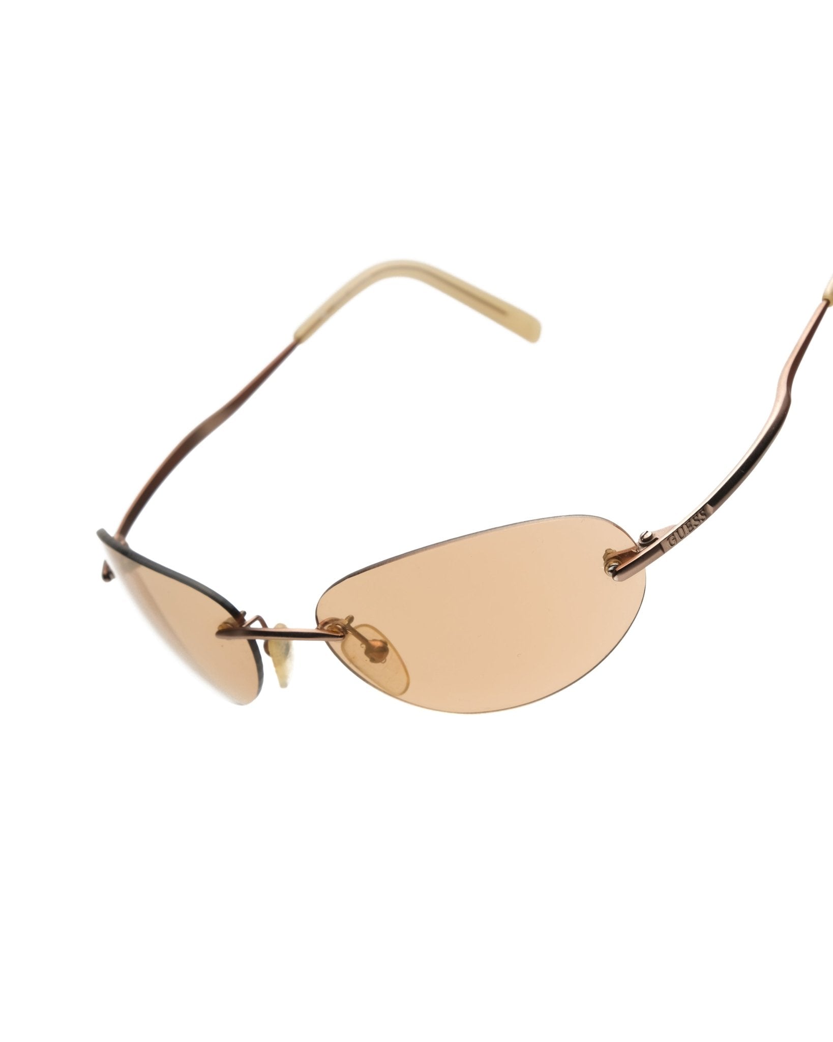 https://cdn.shopify.com/s/files/1/0818/5459/5398/files/guess-guess-rimless-sunglasses-vintage-su357-3187923.jpg?v=1766681208