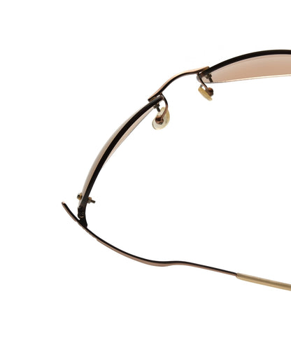 https://cdn.shopify.com/s/files/1/0818/5459/5398/files/guess-guess-rimless-sunglasses-vintage-su357-5935216.jpg?v=1766681211