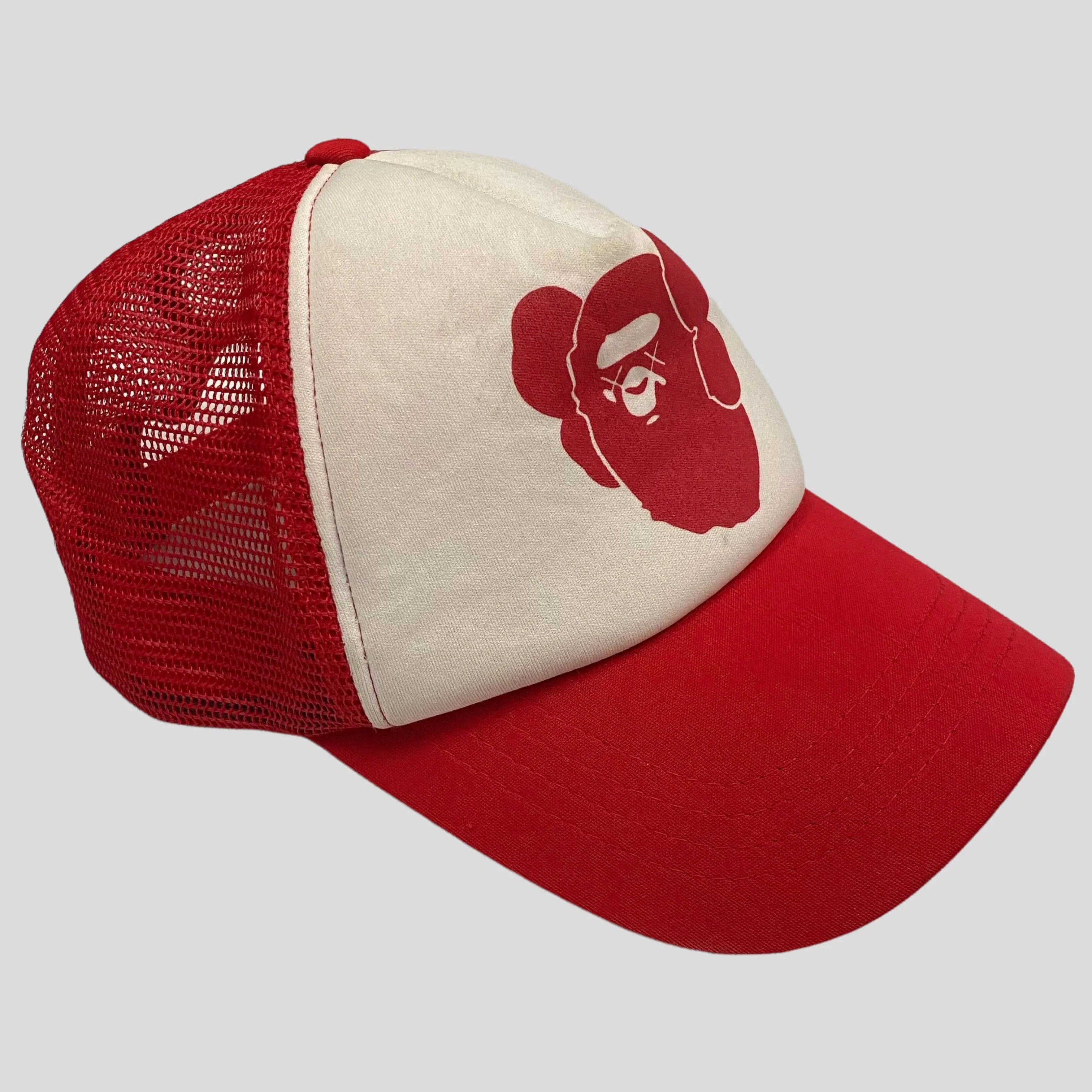 A BATHING APE × KAWS cap