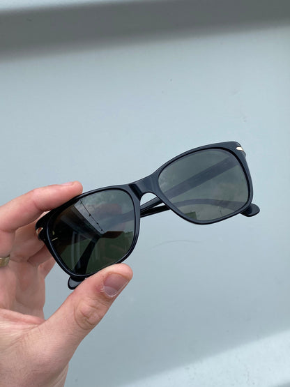 Giorgio Armani Wayfarer sunglasses with black frame and dark tinted lenses, stylish and elegant eyewear for men.