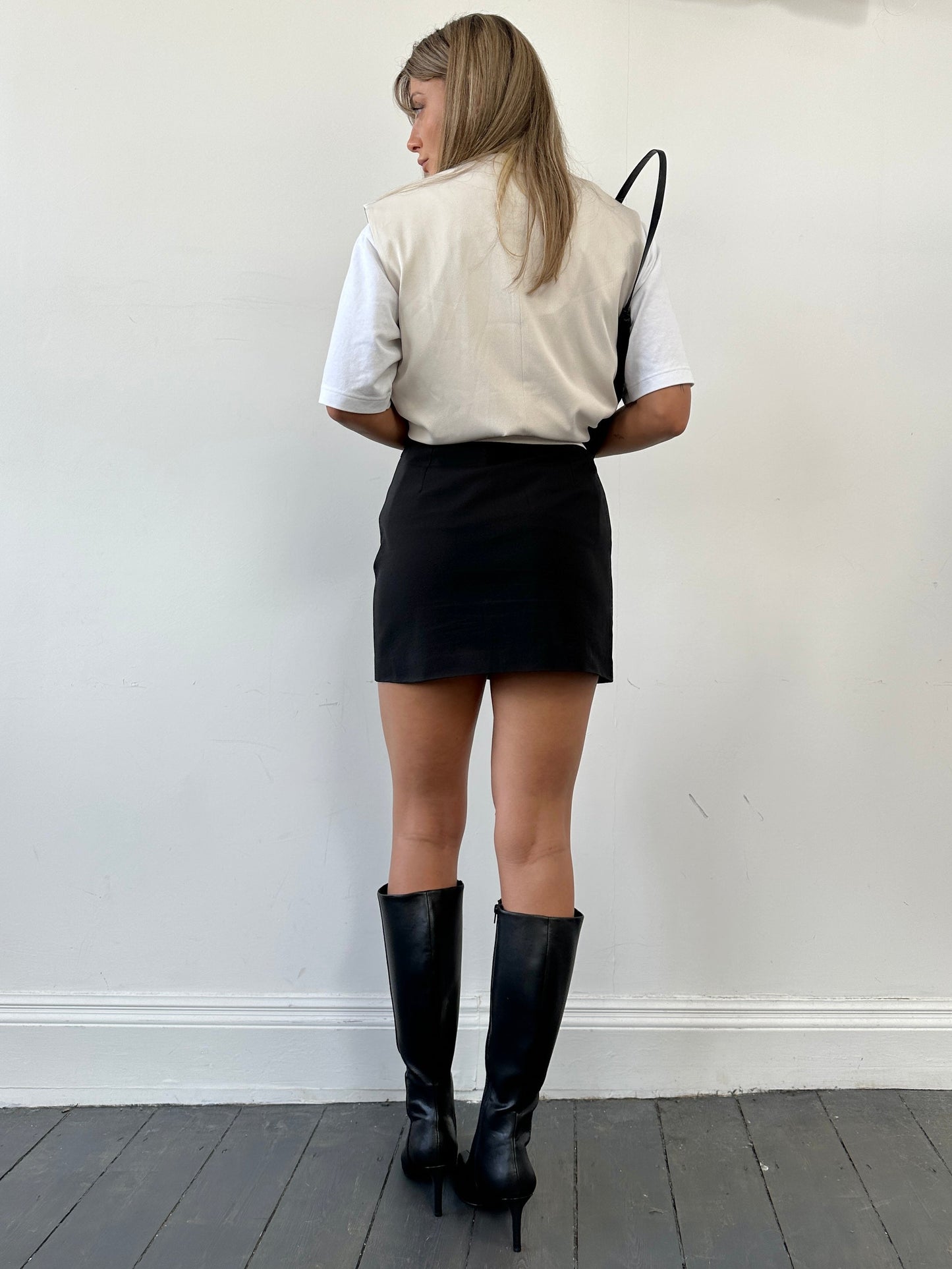 Italian Vintage mini skirt in classic style, showing the detailed fabric and fit, perfect for retro-inspired fashion.