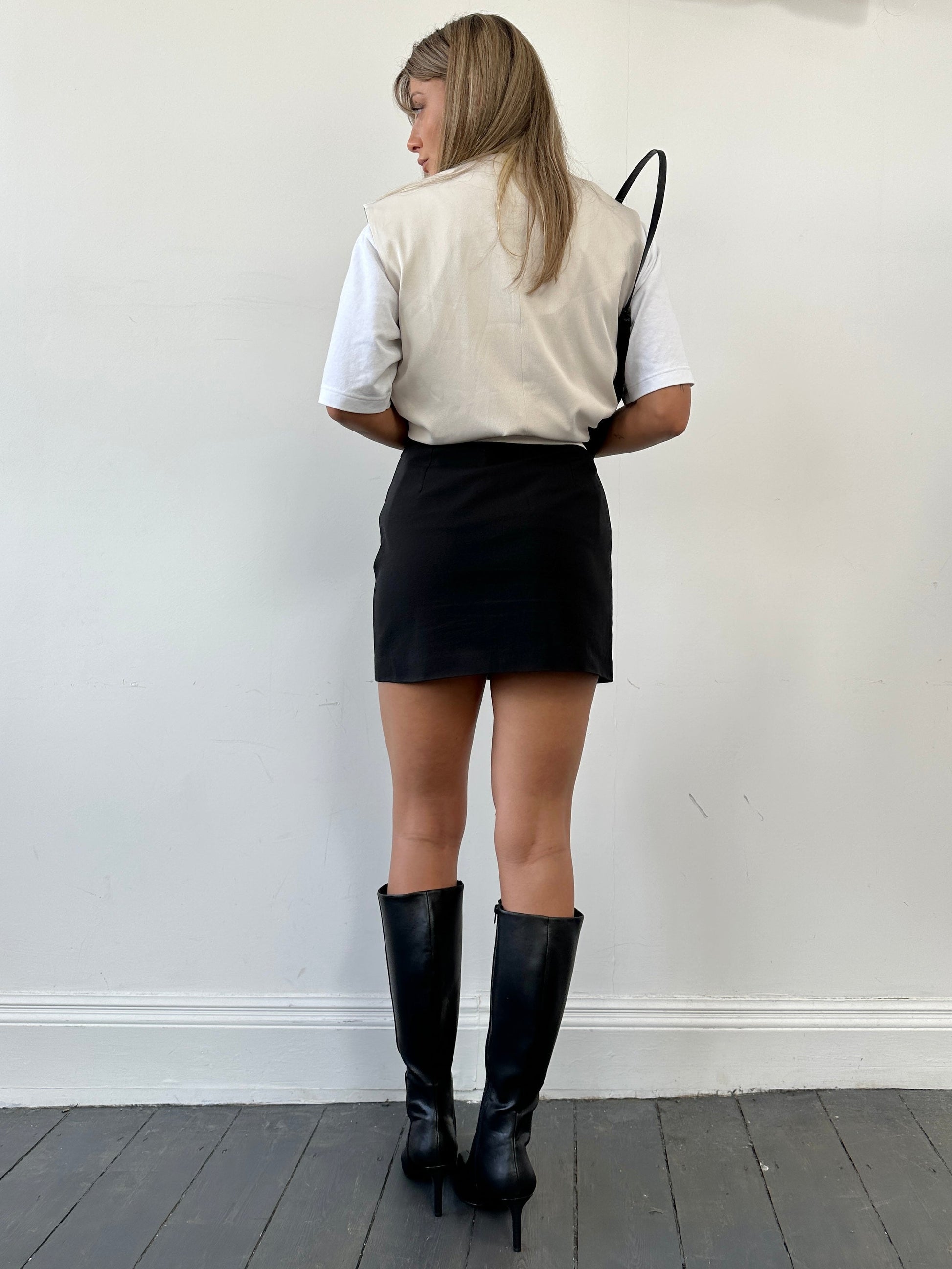 Italian Vintage mini skirt in classic style, showing the detailed fabric and fit, perfect for retro-inspired fashion.