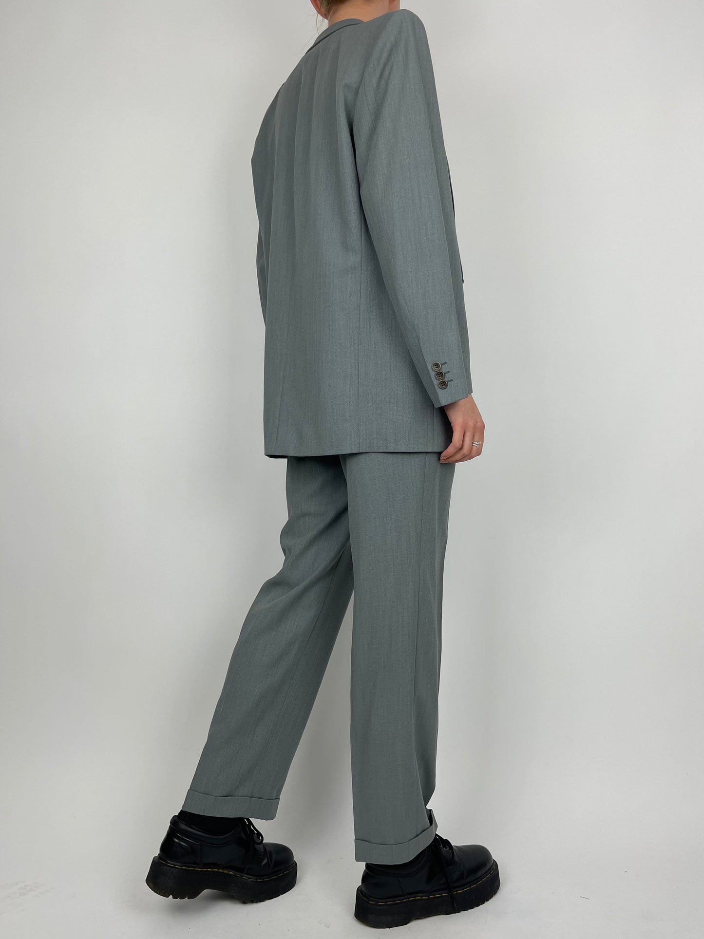 Vintage wool jumpsuit with a tailored fit, featuring a classic design and textured fabric, ideal for stylish vintage fashion.