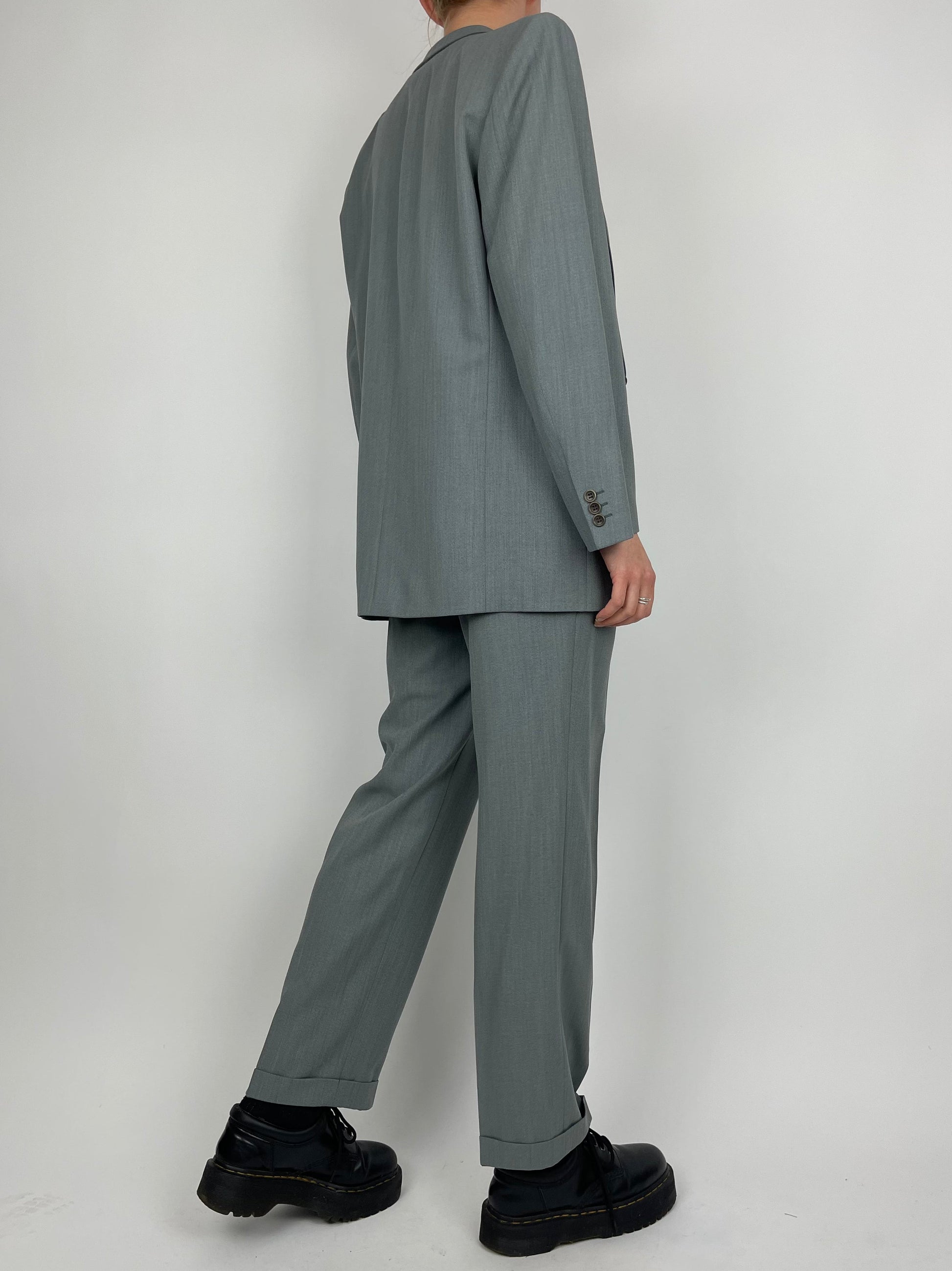 Vintage wool jumpsuit with a tailored fit, featuring a classic design and textured fabric, ideal for stylish vintage fashion.