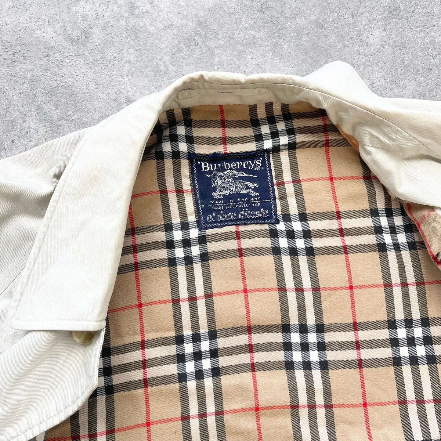 Burberry’s 1990s nova check cream trench jacket (L)