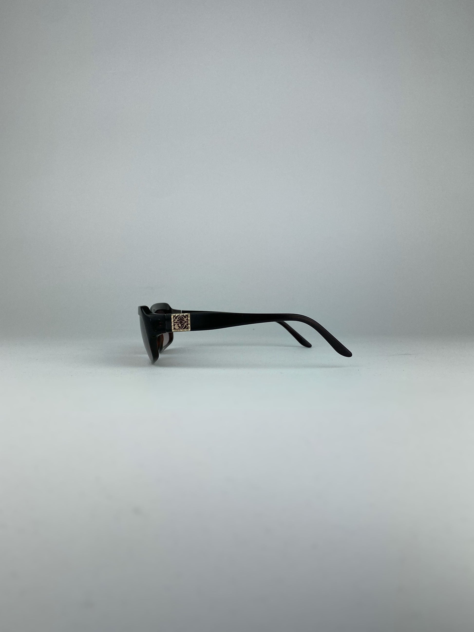 Loewe rectangle sunglasses with brown frames and dark lenses, stylish eyewear for sun protection and fashion.