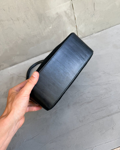 Gucci by Tom Ford Black Leather and Suede Shoulder Bag-on a concrete background