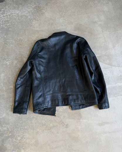 Japanese Black Leather Jacket – M-on a concrete background