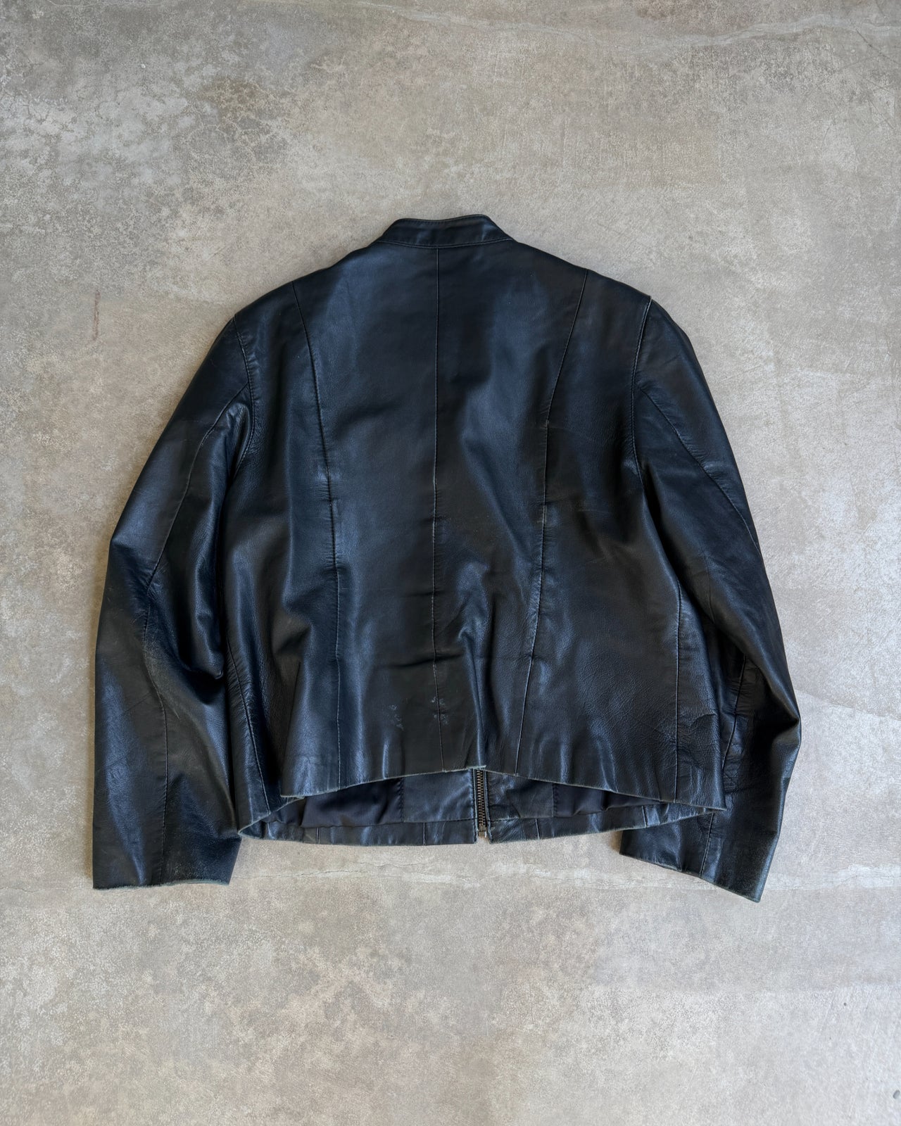 Pallas Cuir Boxy Black Leather Jacket – S/M-on a concrete background