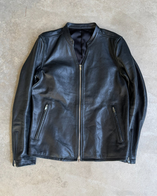 Japanese Black Leather Jacket – M-on a concrete background