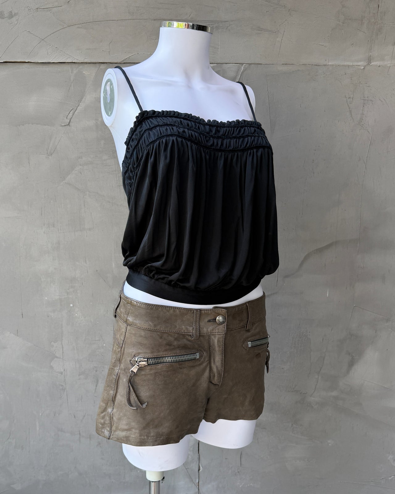 Miu Miu Black Acetate Nylon Blend Top – S-on a concrete background