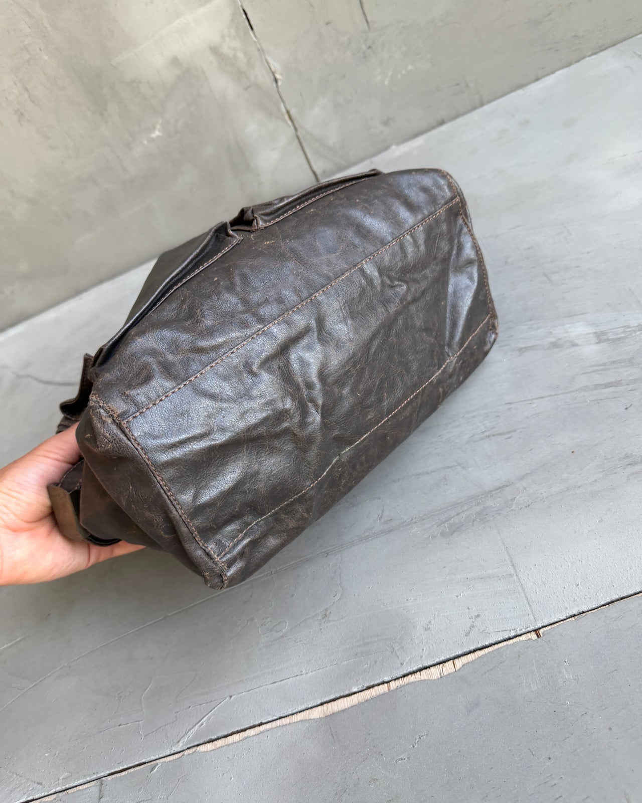 Armani Jeans Brown Leather Handbag-on a concrete background